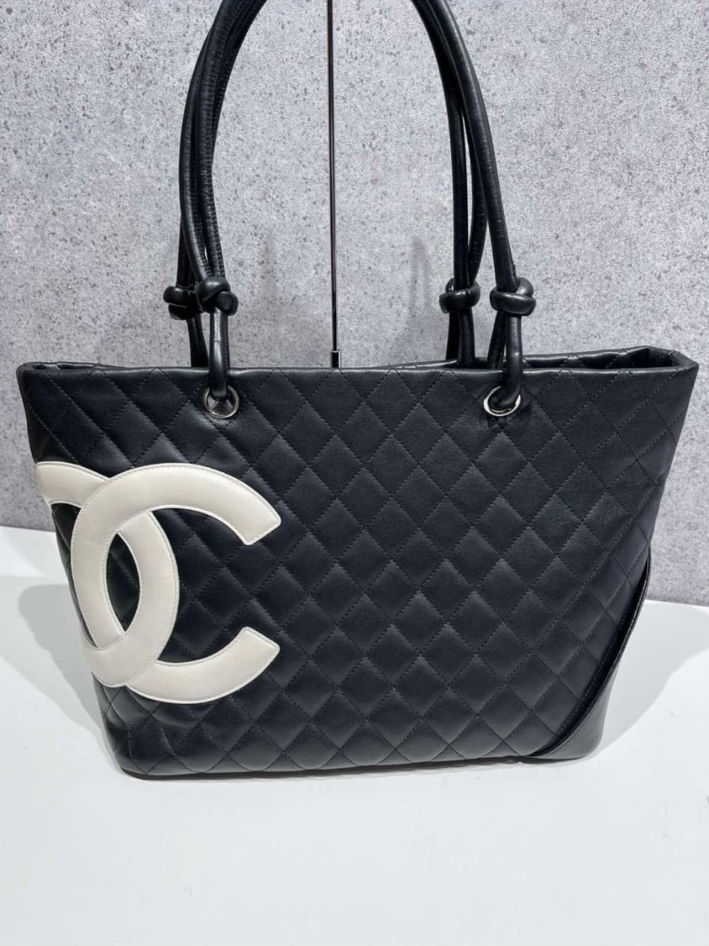 CHANEL Black Quilted Leather Tote with White CC Emblem